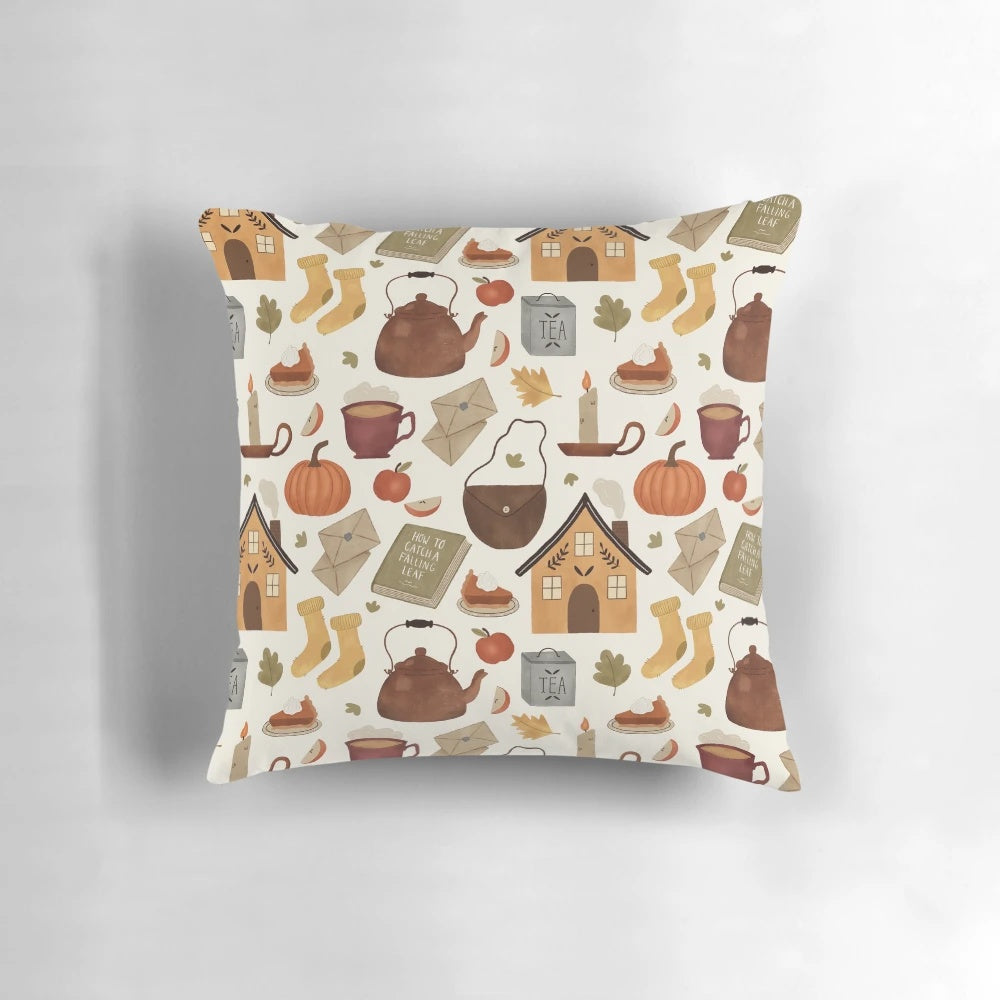 Autumn cottage-themed pillow with knit texture, pumpkins, and a teacup design, perfect for a cozy reading nook.
