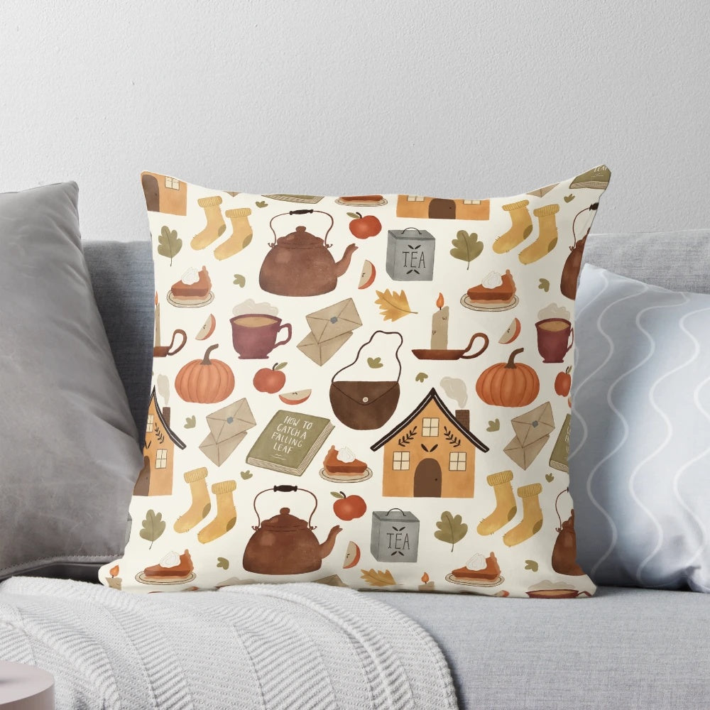 Autumn cottage-themed pillow with knit texture, pumpkins, and a teacup design, perfect for a cozy reading nook.