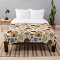 Autumn-inspired plush blanket with cozy cottage design