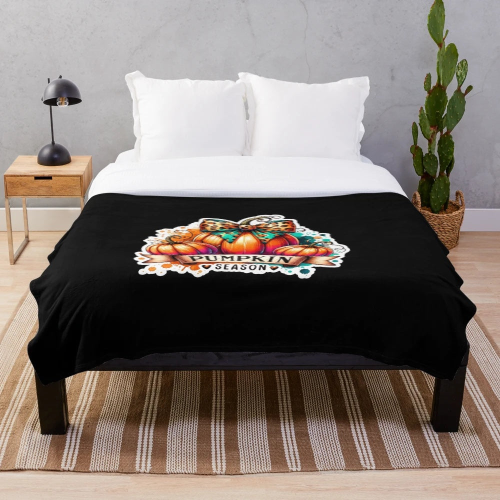 Plush blanket with a playful watercolor pumpkin design, perfect for autumn