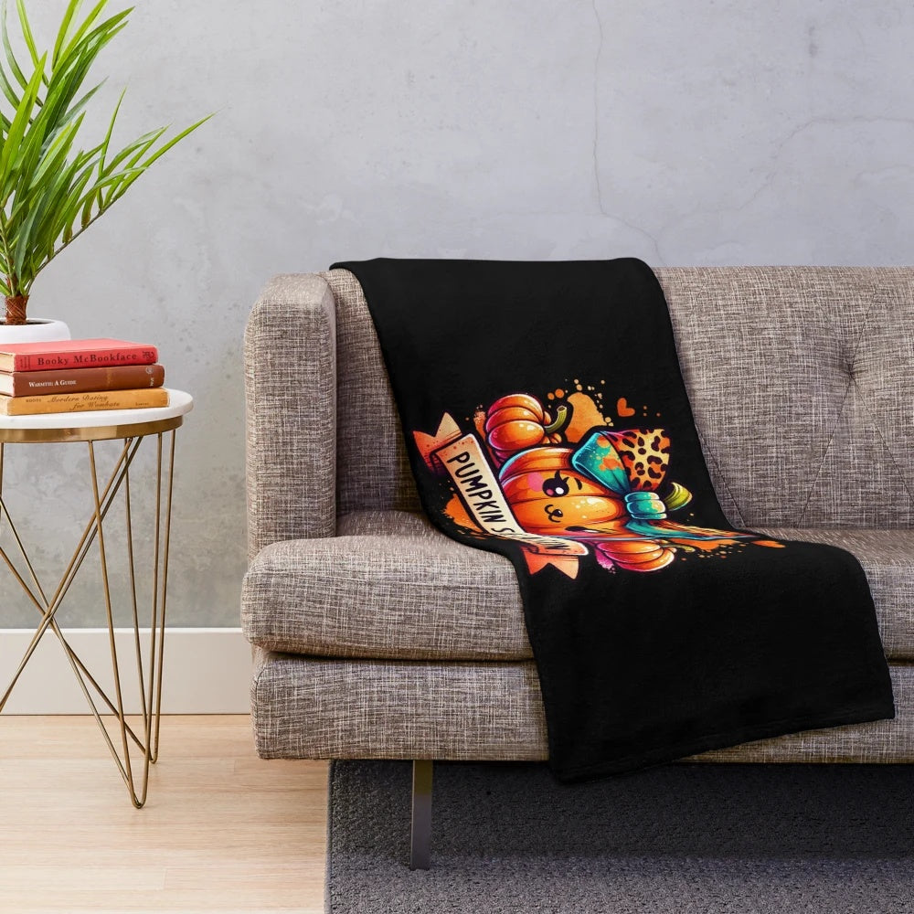 Plush blanket featuring a watercolor pumpkin design in autumn hues