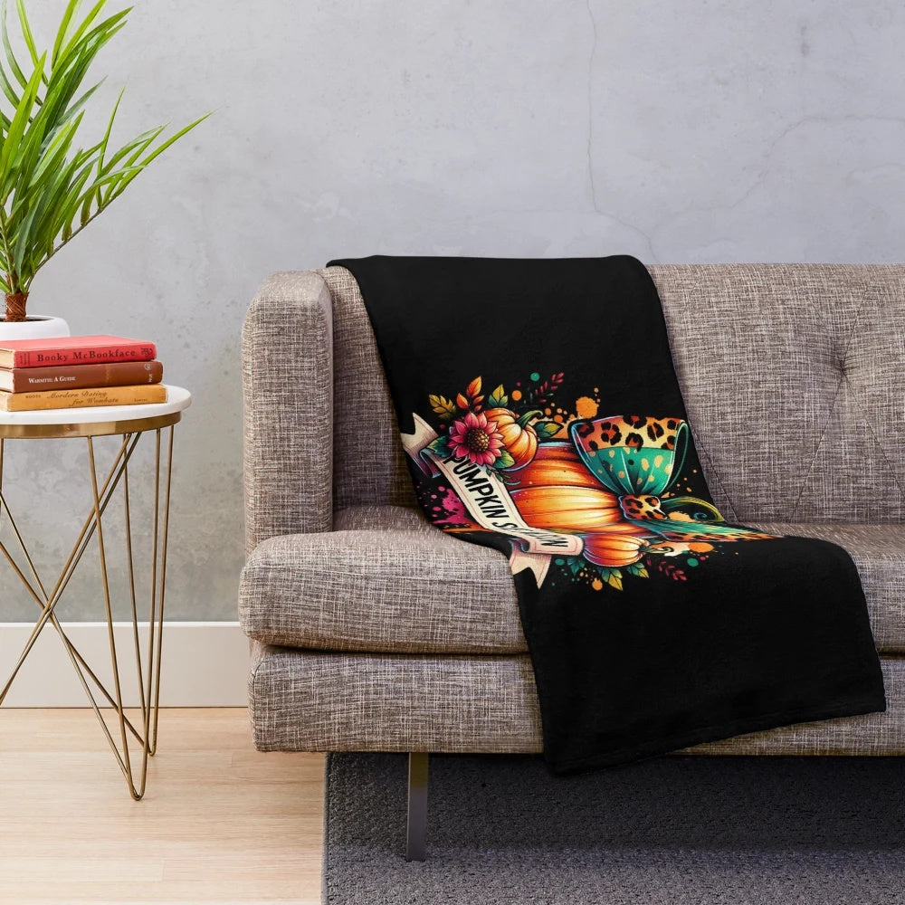 Plush blanket with a watercolor pumpkin design in autumn colors