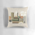 A decorative throw pillow featuring a cityscape of Birmingham, UK in autumn colors