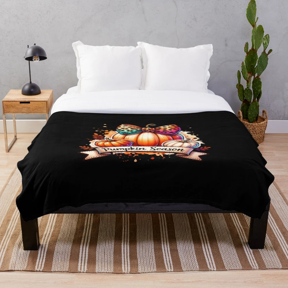 Plush blanket with vintage-inspired watercolor pumpkin design