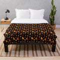 Plush blanket with a decorative fall leaves and cat pattern