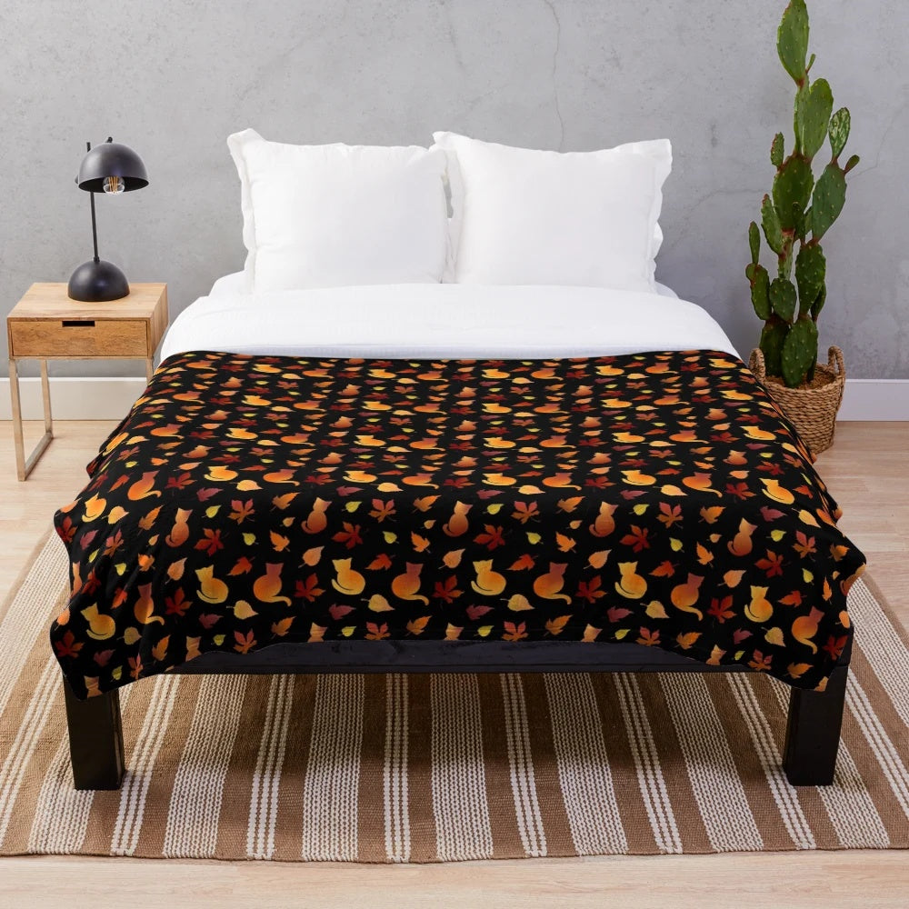 Plush blanket with a decorative fall leaves and cat pattern
