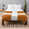 Maple brown plush blanket with an abstract, minimal autumn design