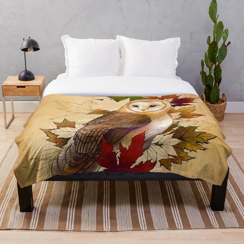 Cozy plush blanket featuring a watercolor design of autumn maple leaves and a barn owl