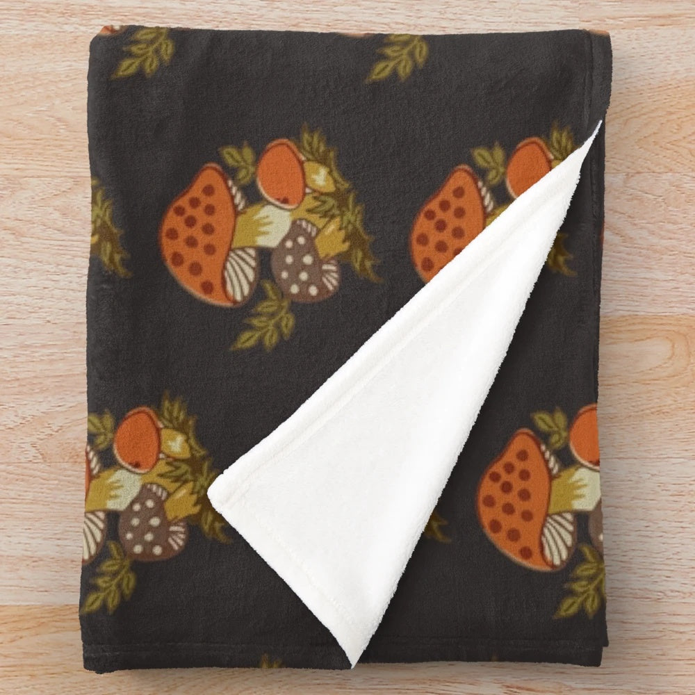 Soft and plush blanket with a retro autumn mushroom design