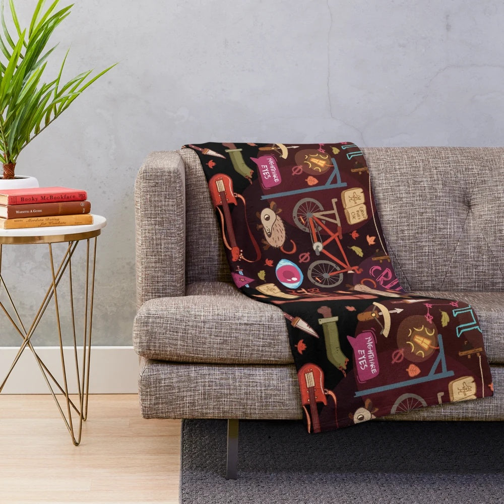 Cozy autumn pattern plush blanket featuring the Night in the Woods indie game design