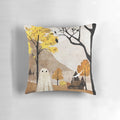 A cozy throw pillow featuring a beautiful autumn landscape with trees, mountains, and a cabin with a smoking chimney.