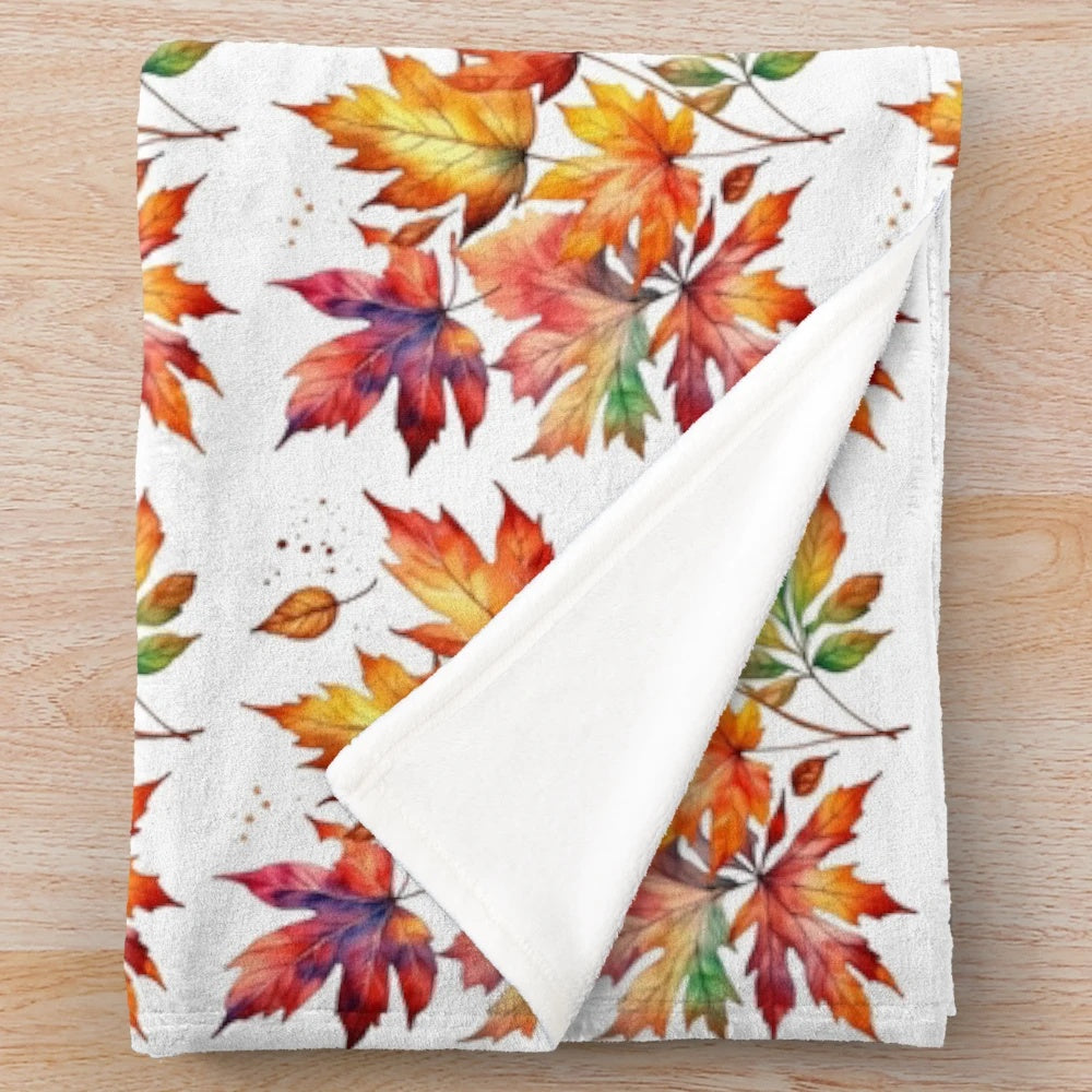 Plush autumn-themed blanket with warm, nature-inspired colors and patterns