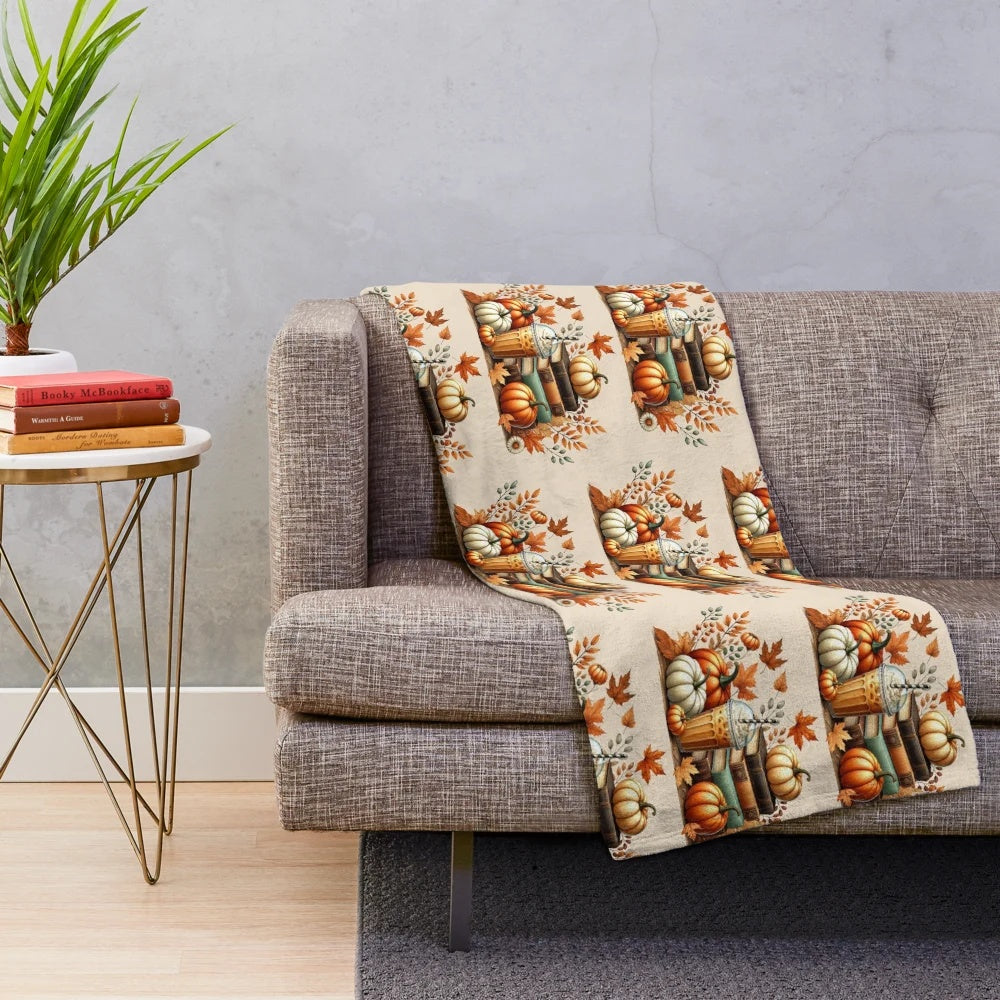 Cozy fall plush blanket with books, iced coffee, and pumpkins