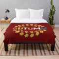 Autumn-themed plush blanket with warm, cozy texture