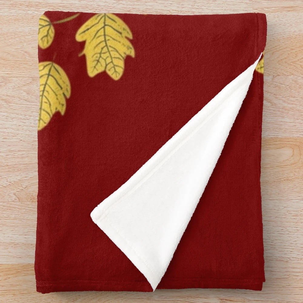 Autumn-themed plush blanket with warm, cozy texture