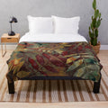 Autumn-inspired plush blanket with botanical leaves and foliage