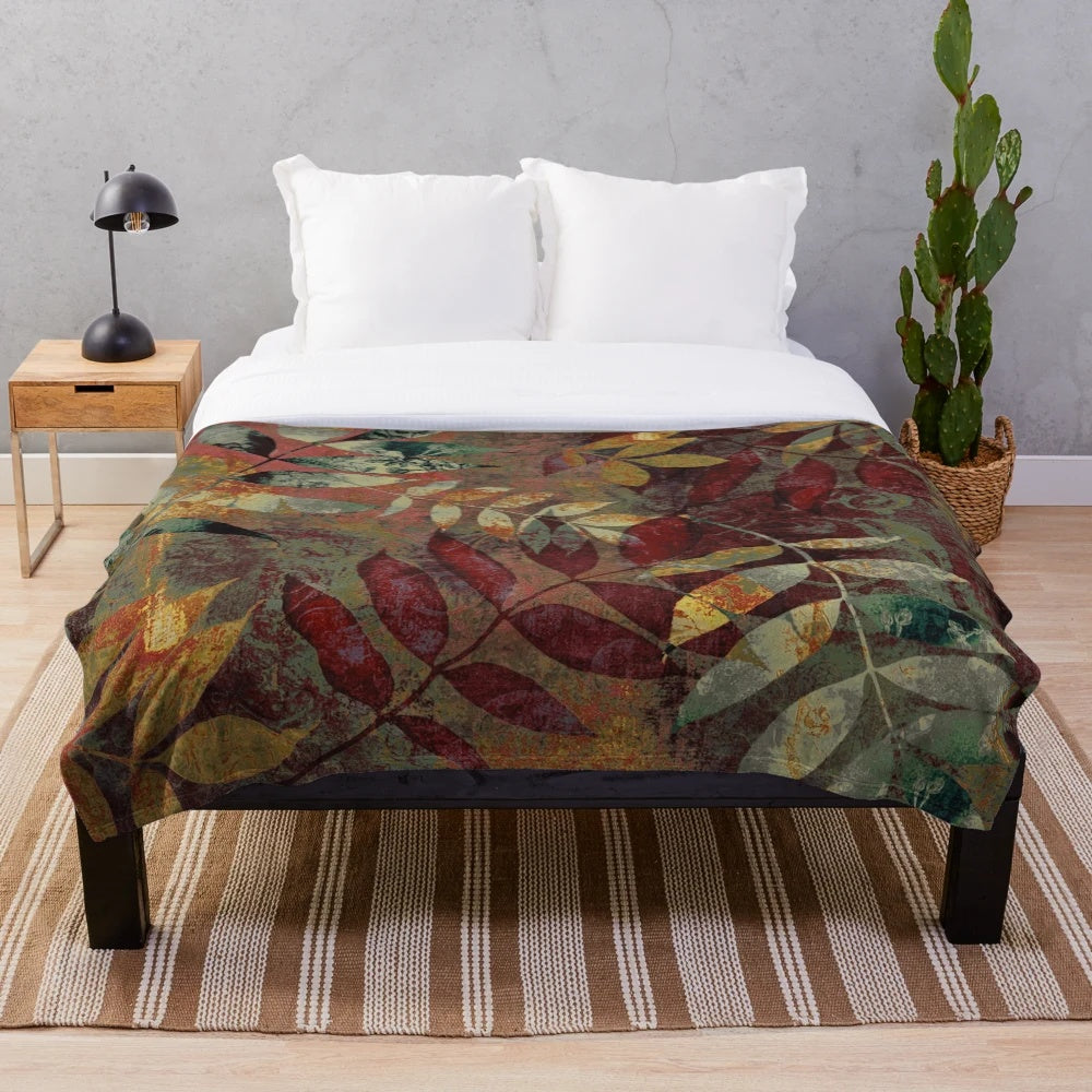 Autumn-inspired plush blanket with botanical leaves and foliage