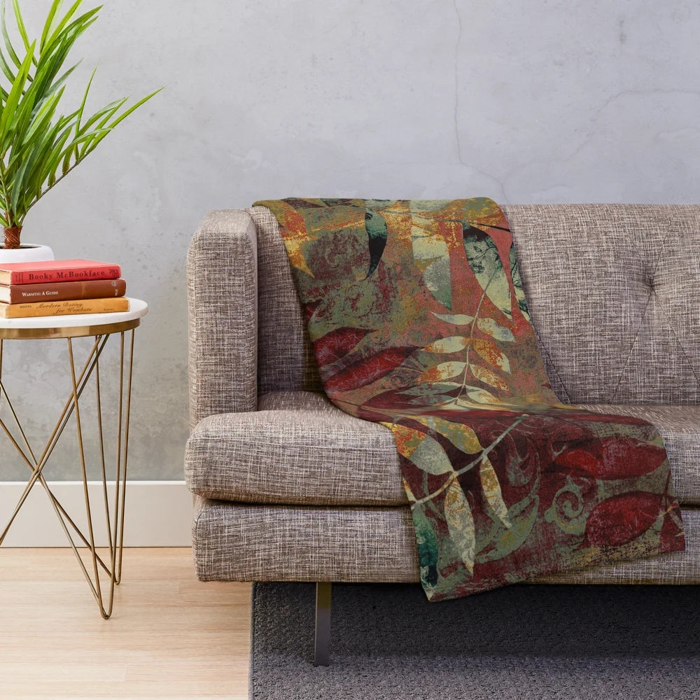 Autumn-inspired plush blanket with botanical leaves and foliage