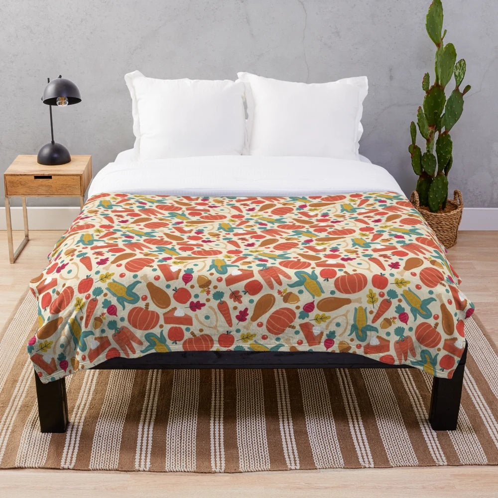 Thanksgiving-themed plush blanket with pumpkin pie, carrots, and autumn leaves