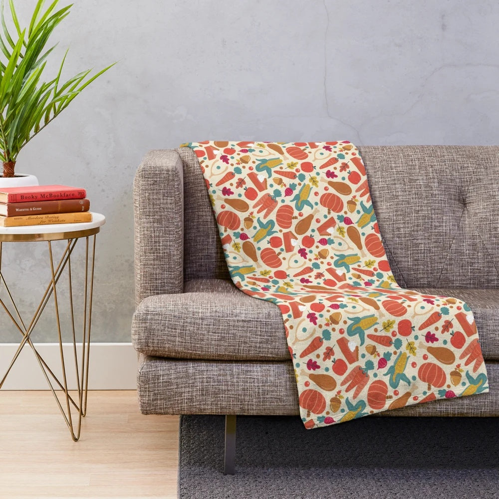 Thanksgiving-themed plush blanket with pumpkin pie, carrots, and autumn leaves