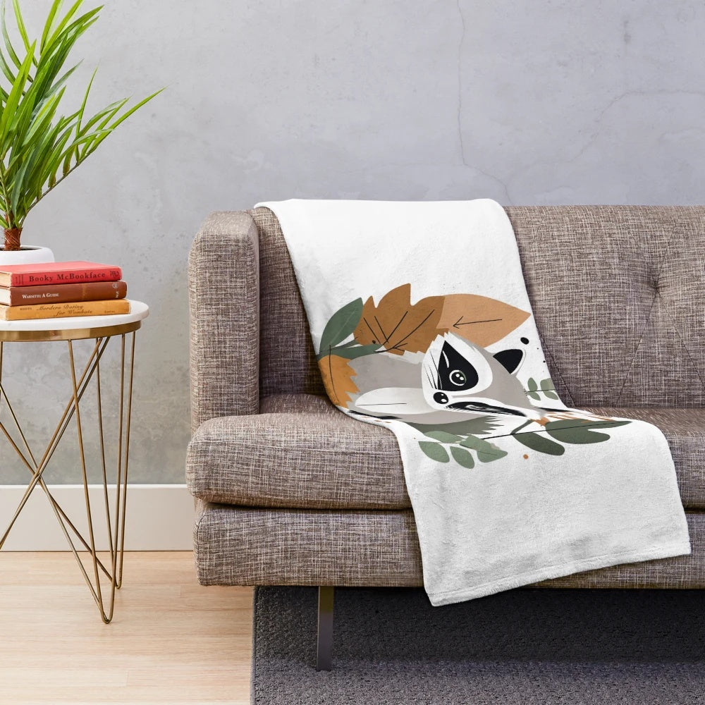 Plush blanket featuring a cute raccoon (trash panda) and autumn nature elements