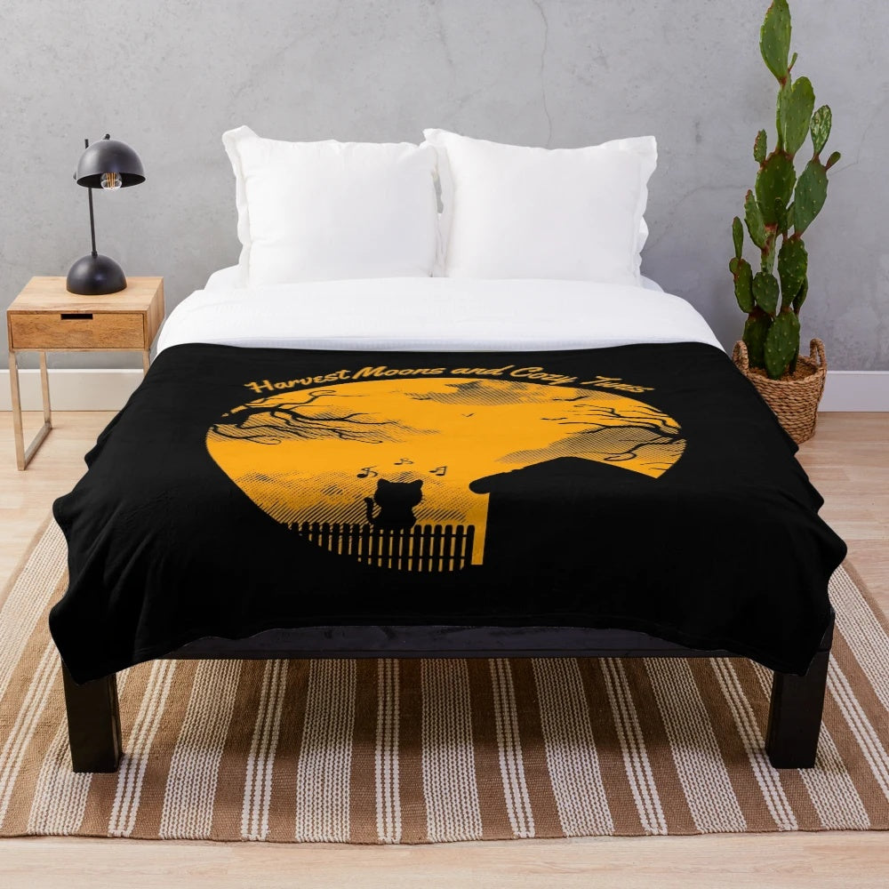 Cozy autumn plush blanket with harvest moon silhouette and music notes