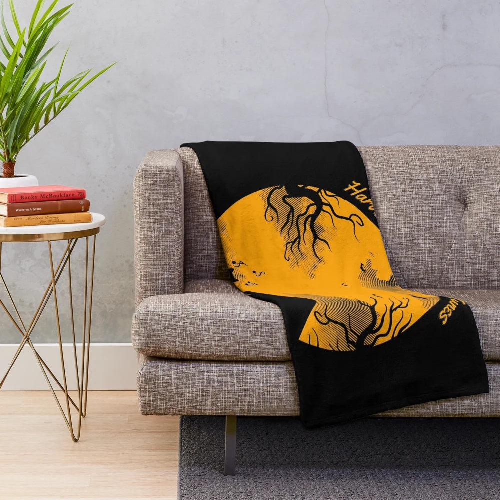 Cozy autumn plush blanket with harvest moon silhouette and music notes