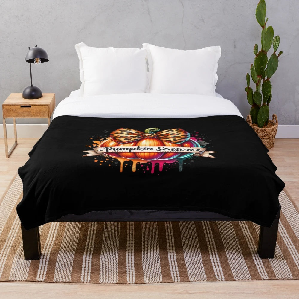 Cozy pumpkin-themed plush blanket with retro autumn design