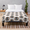 Cozy fall-themed plush blanket with ghostly and spooky elements