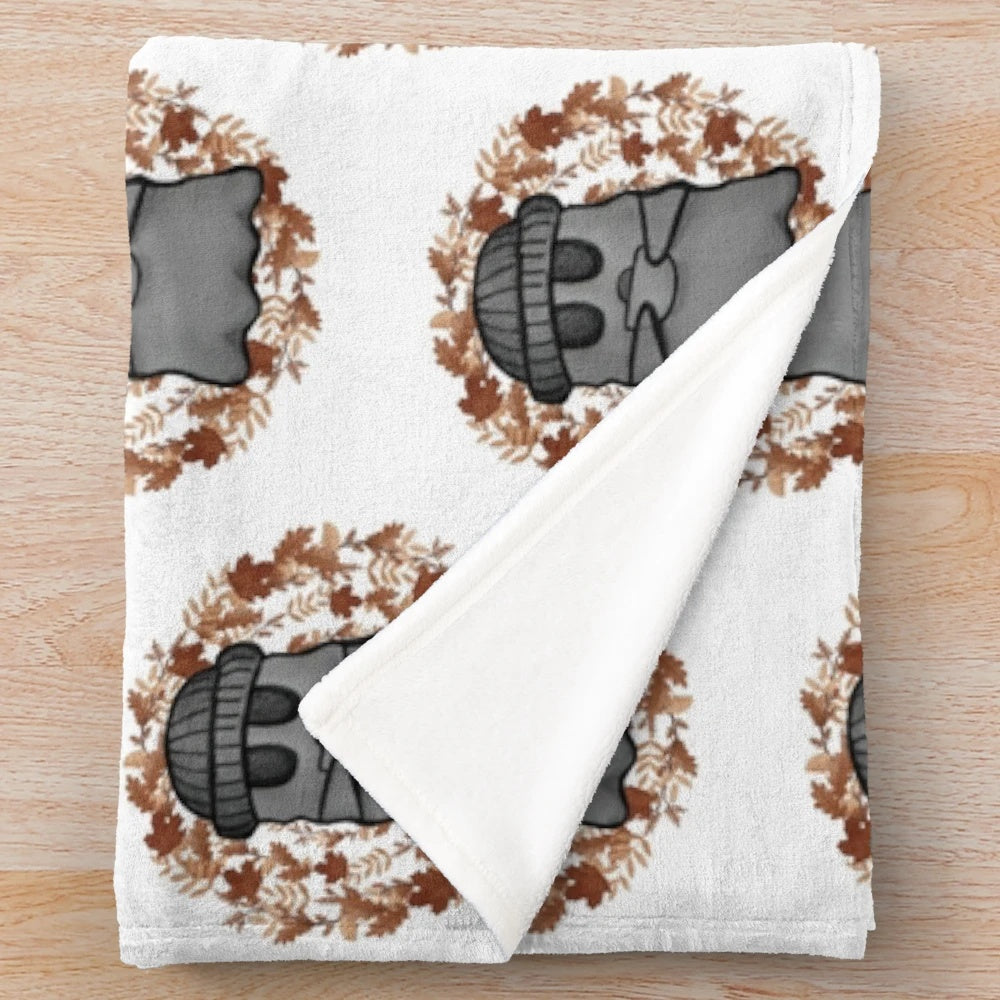 Cozy fall-themed plush blanket with ghostly and spooky elements