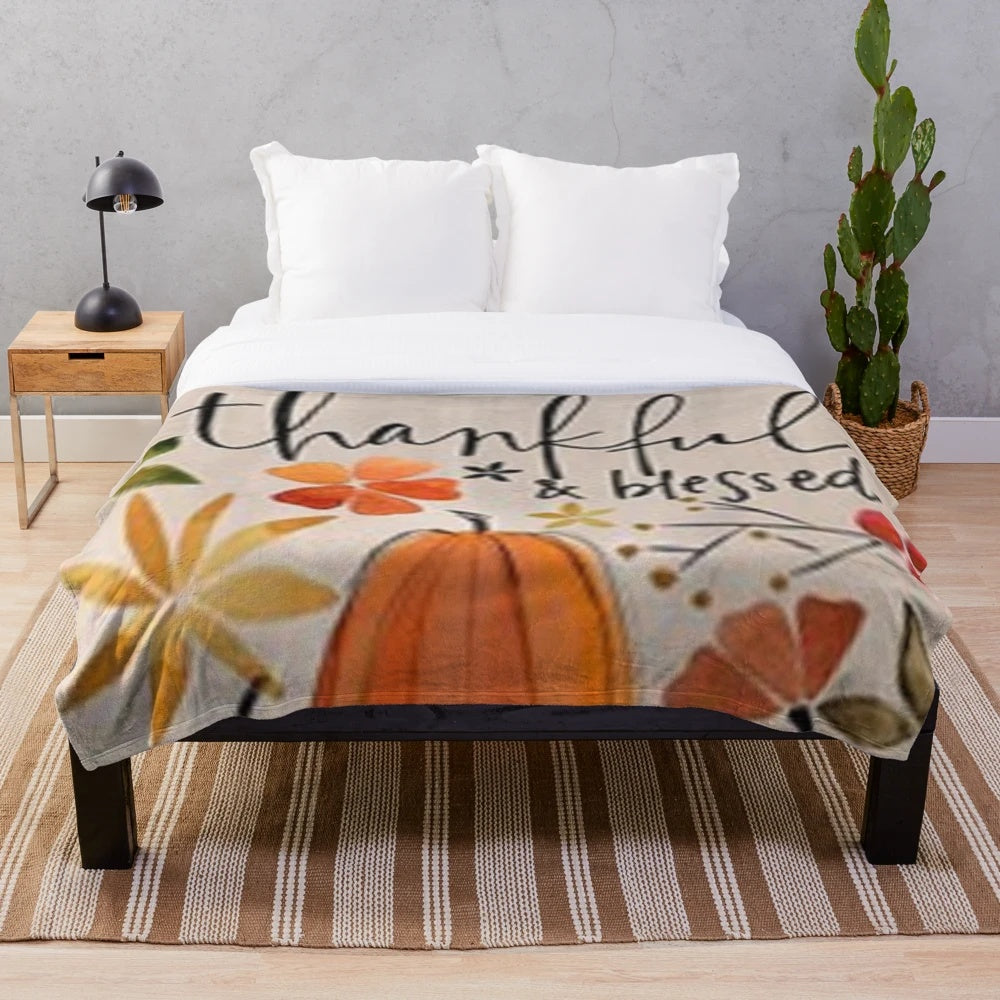 Plush blanket with fall-themed "Thankful and Blessed" print