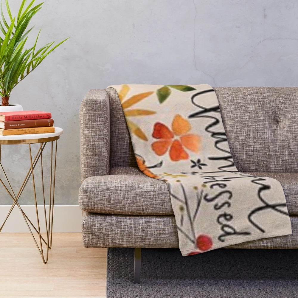 Plush blanket with fall-themed "Thankful and Blessed" print