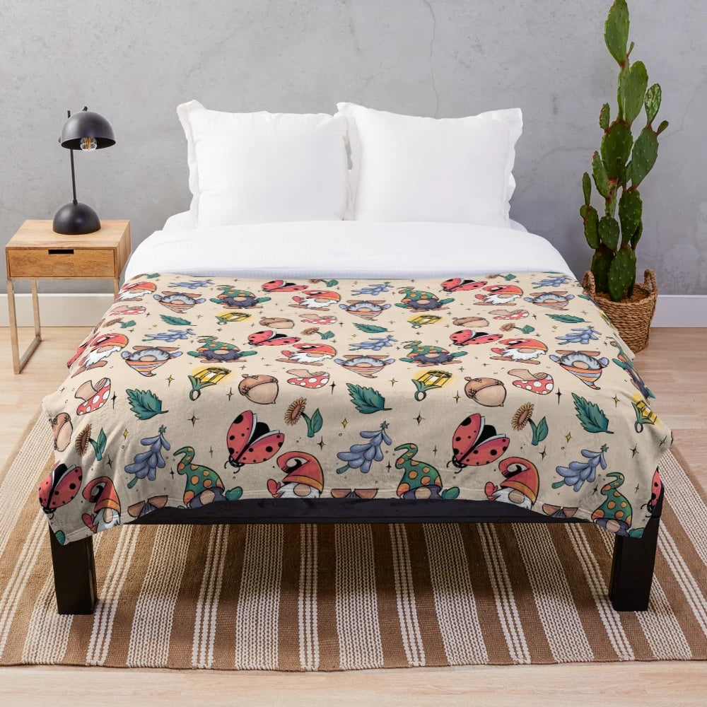 Plush blanket with autumn-themed gnome design