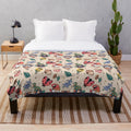 Plush blanket with autumn-themed gnome design
