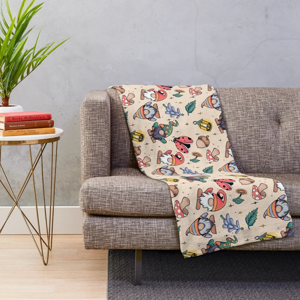 Plush blanket with autumn-themed gnome design
