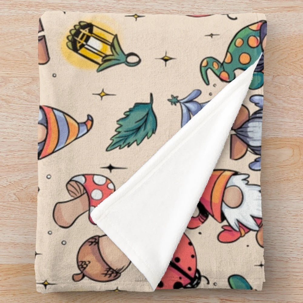 Plush blanket with autumn-themed gnome design