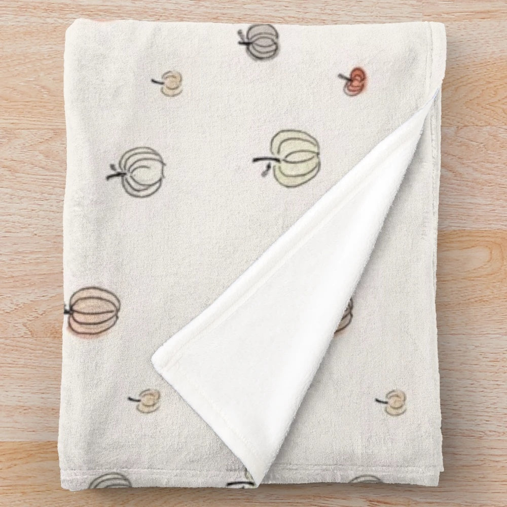 Cozy white pumpkin patterned plush blanket for autumn and Halloween