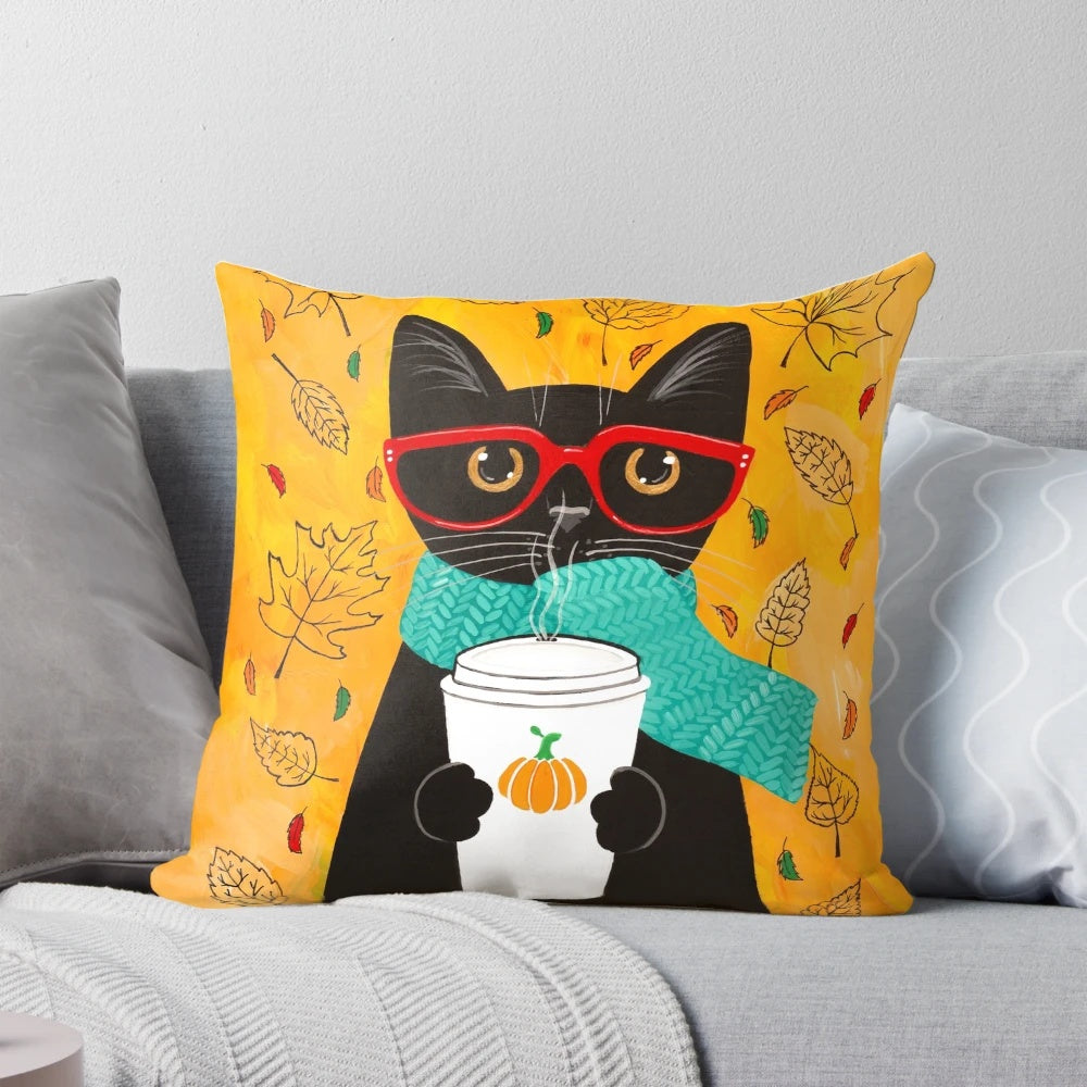 A cozy autumn-themed pillow featuring a cat wearing glasses and holding a pumpkin spice latte