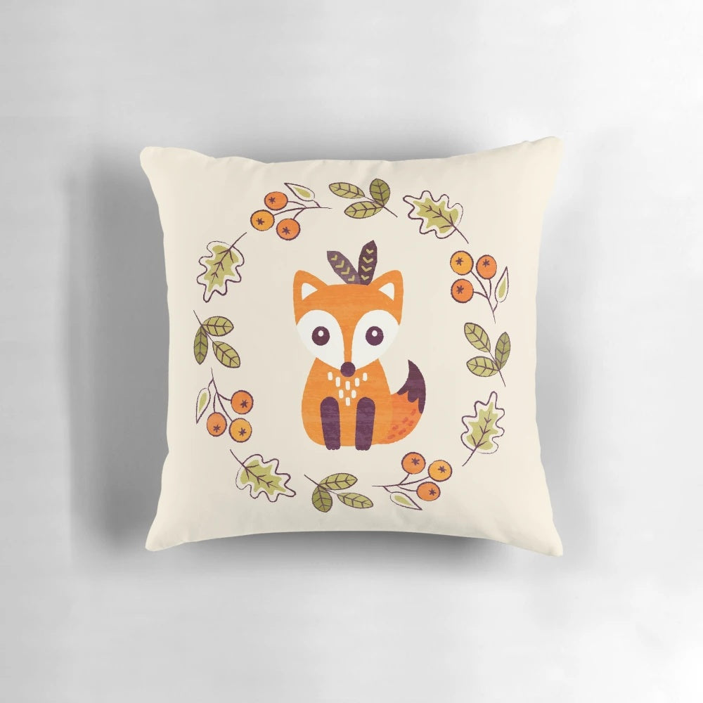 A decorative pillow featuring a cute red fox surrounded by autumn berries and foliage on a neutral background.