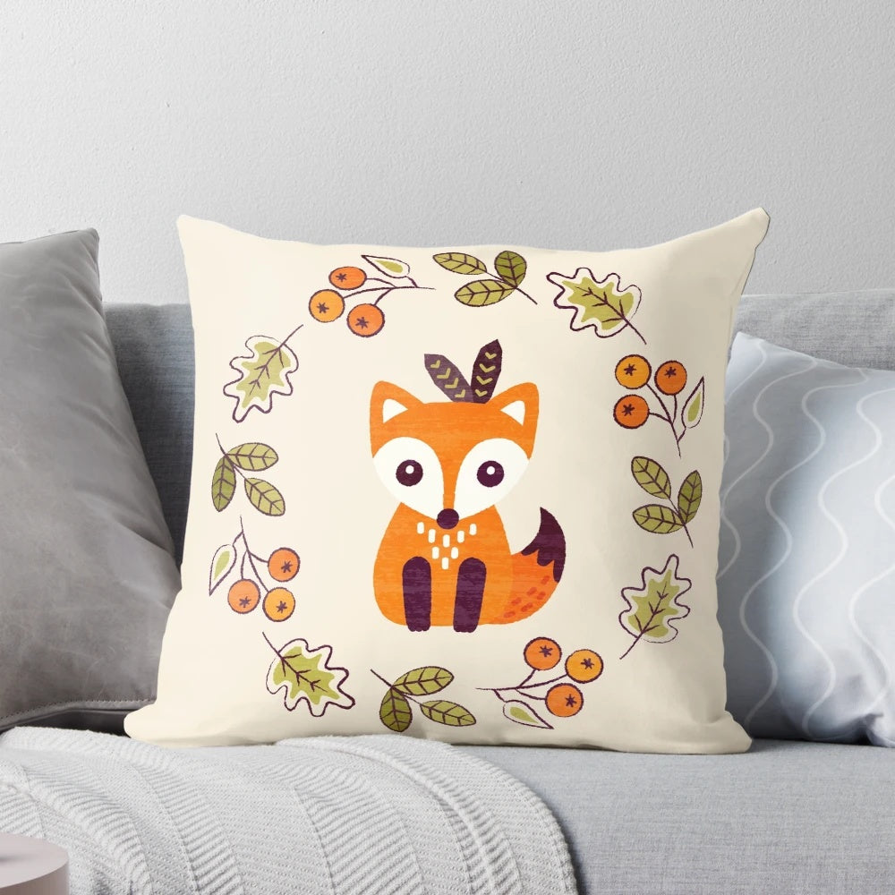 A decorative pillow featuring a cute red fox surrounded by autumn berries and foliage on a neutral background.