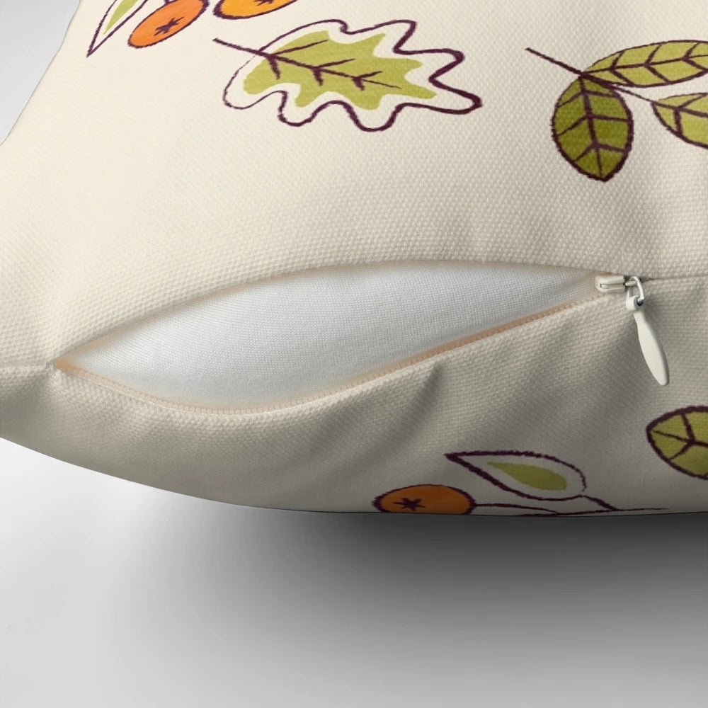 A decorative pillow featuring a cute red fox surrounded by autumn berries and foliage on a neutral background.
