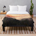 Plush blanket featuring an autumn sunrise landscape with a misty forest