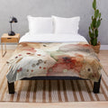 Cozy plush blanket with a watercolor abstract art design featuring autumn hues and nature elements