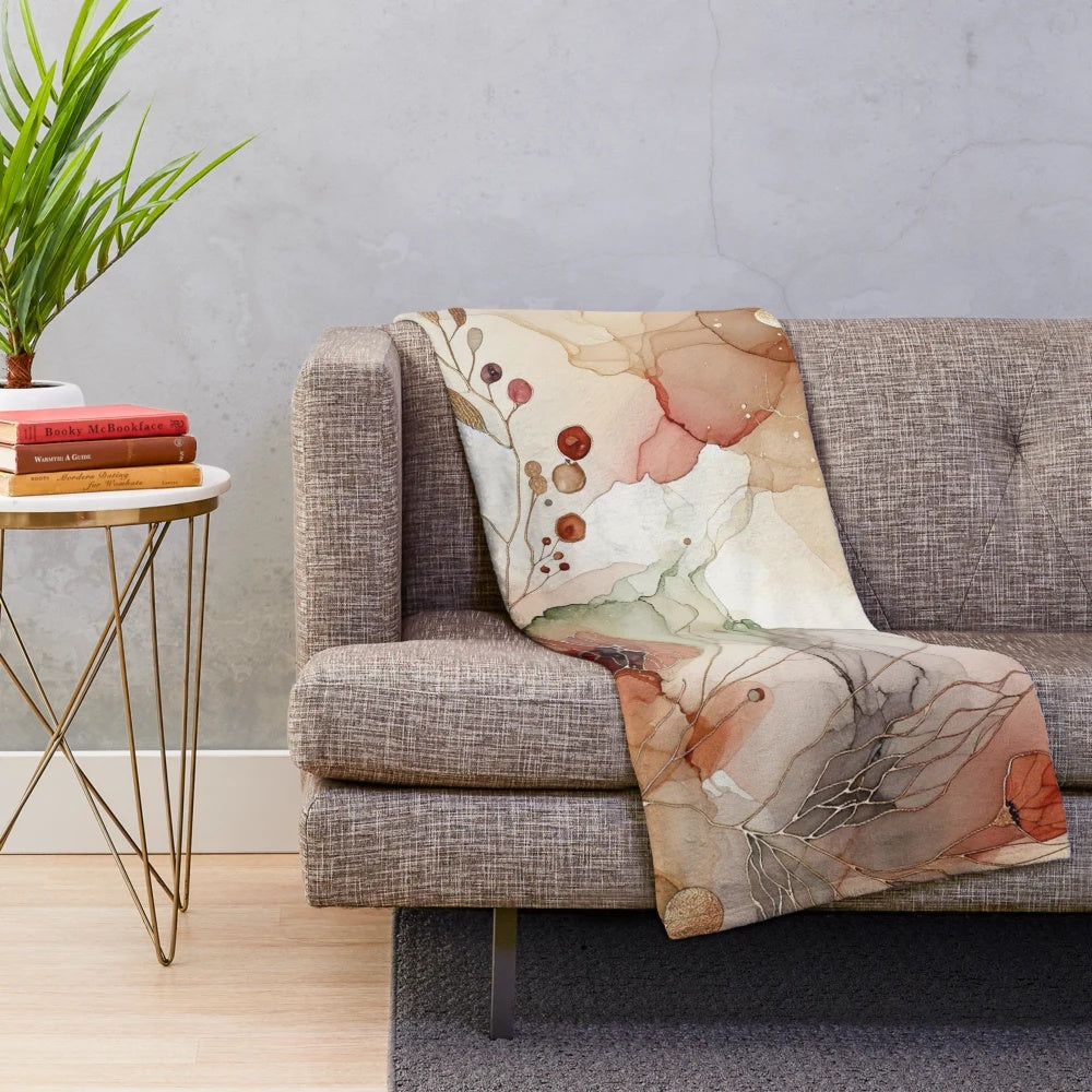 Cozy plush blanket with a watercolor abstract art design featuring autumn hues and nature elements