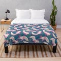 Axolotl plush blanket with a pink and white pattern
