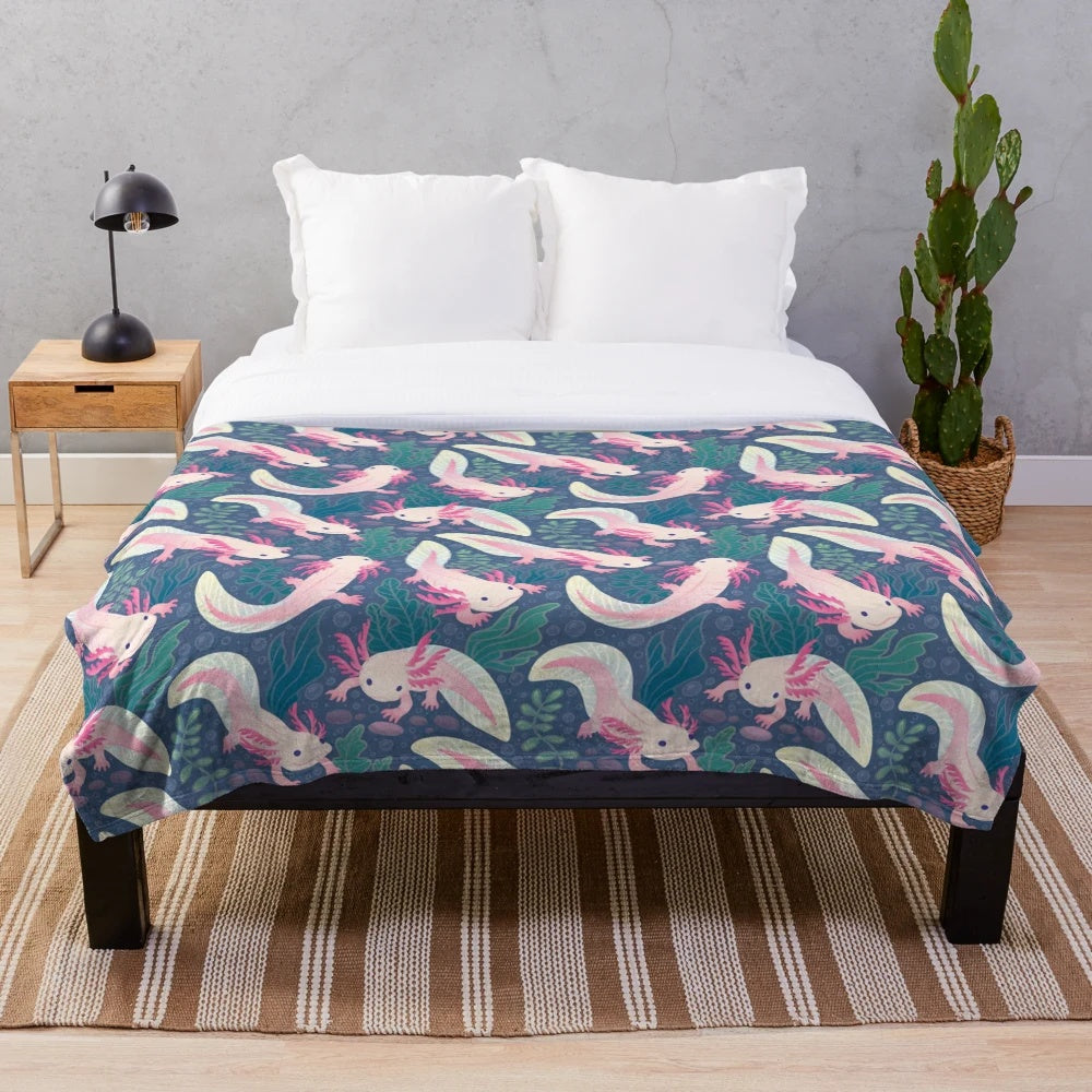 Axolotl plush blanket with a pink and white pattern