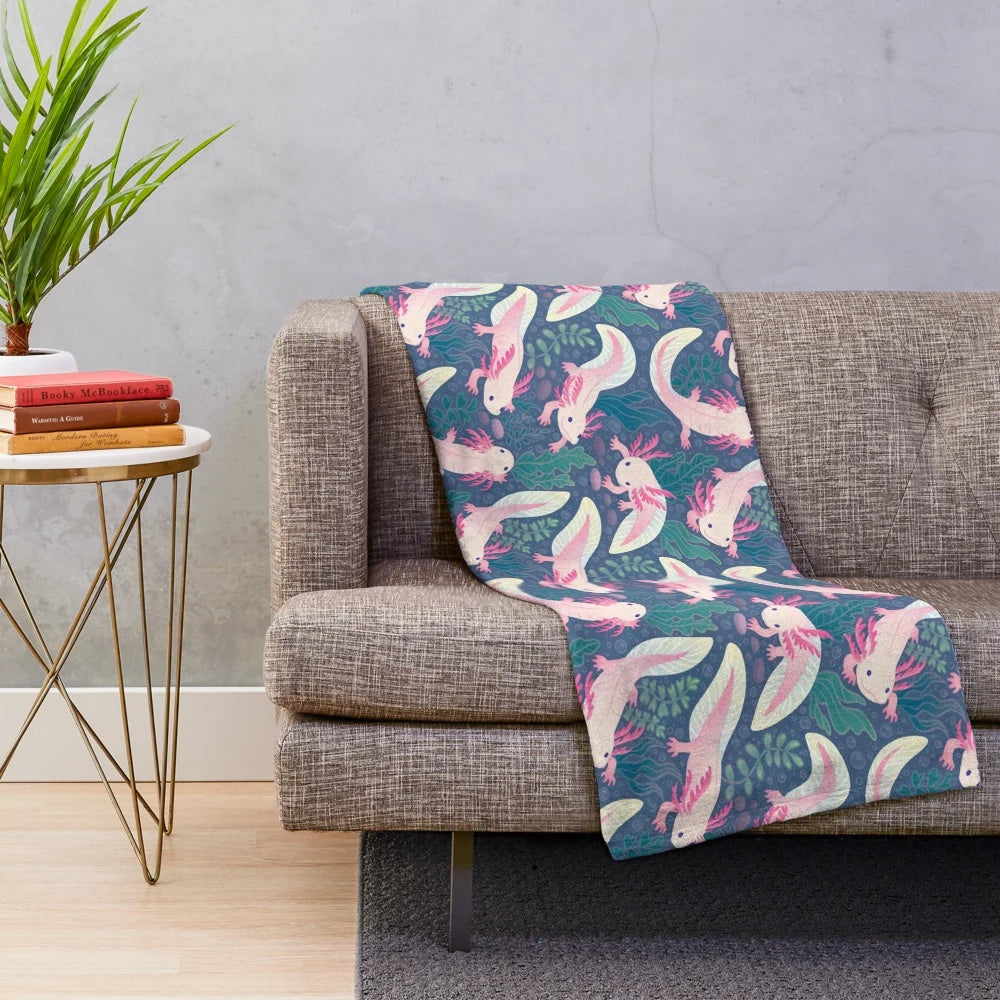 Axolotl plush blanket with a pink and white pattern