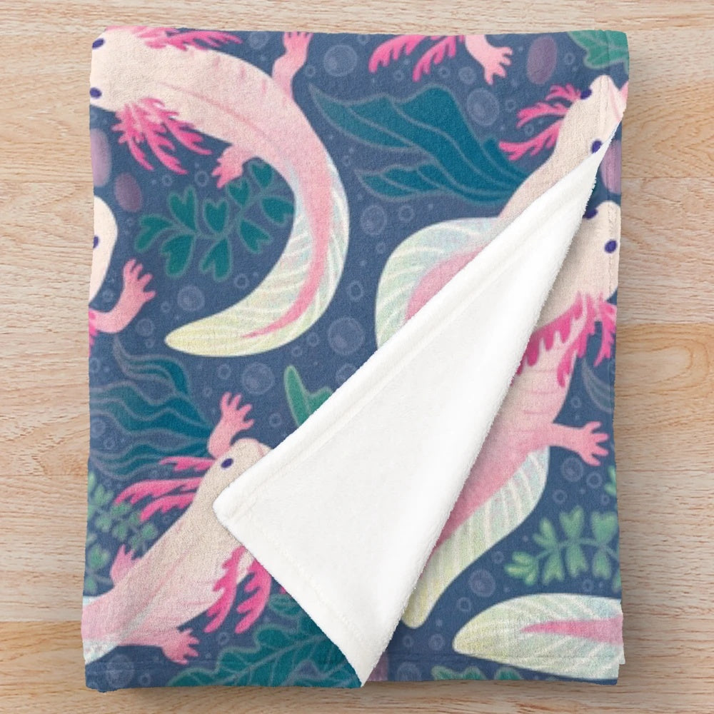 Axolotl plush blanket with a pink and white pattern