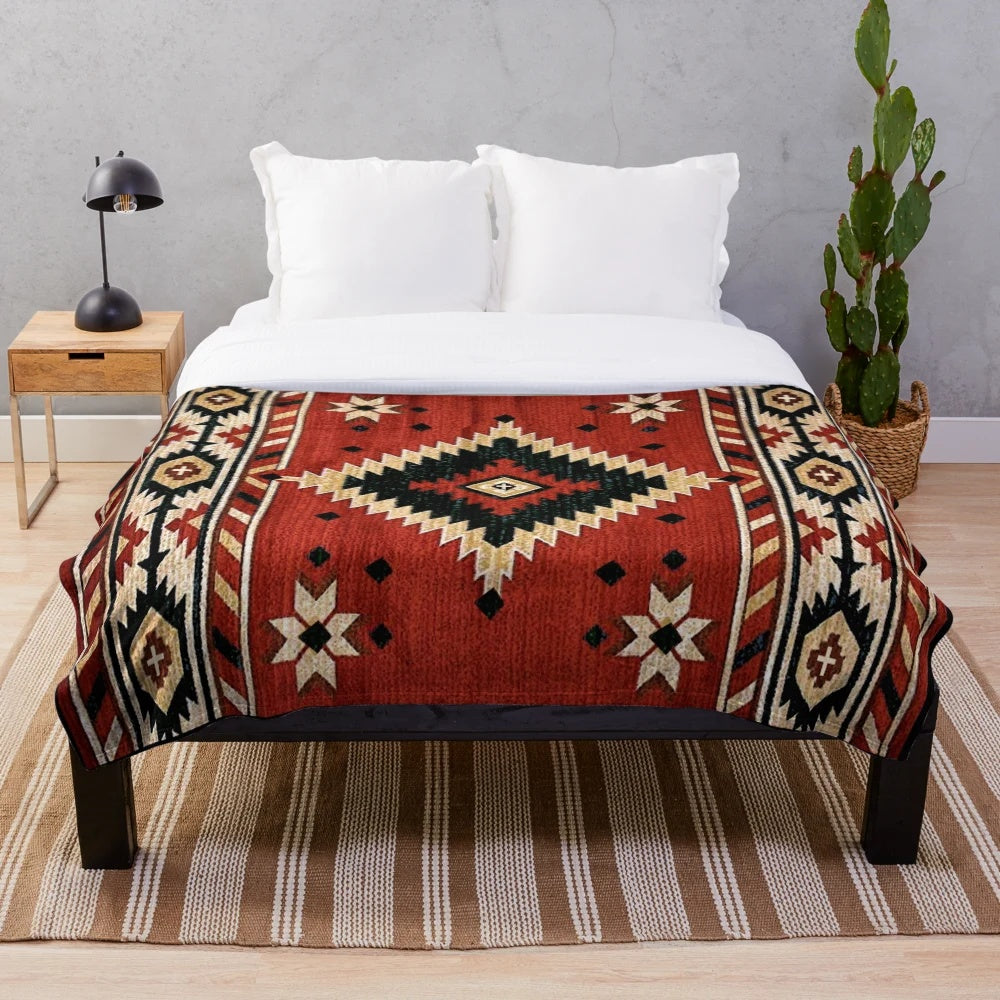 Aztec-patterned plush blanket in bright, bold colors