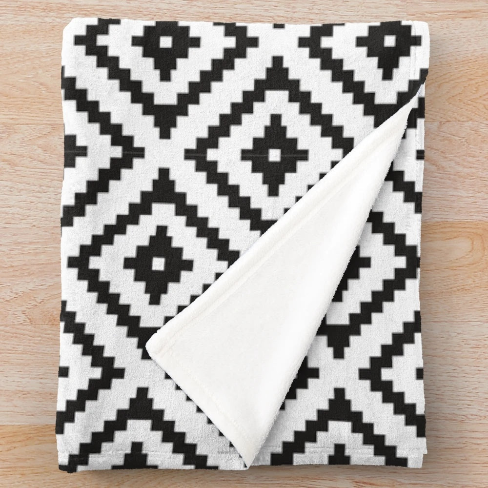 Soft, plush black and white blanket with Aztec-inspired tribal pattern design